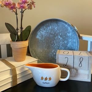 Brand New Rae Dunn Gravy Boat. Orange interior.